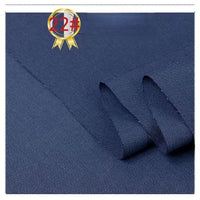 Close-up of Longan Craft's Twill Cotton Lyocell Fabric in dark blue, showing its textured weave. A ribbon badge with "22#" appears in the top left corner. Ideal comfy, breathable material for shirts, sold by the yard.
