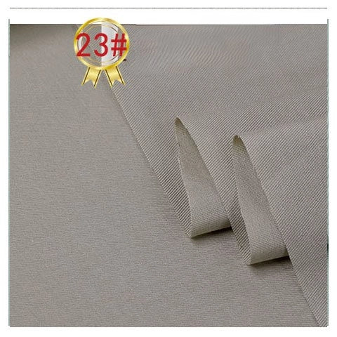 A close-up of Longan Craft’s Twill Cotton Lyocell Fabric By The Yard in light grey, smooth and partially folded. A gold badge with “23#” in red appears in the top left corner. Perfect for comfy, breathable shirts.