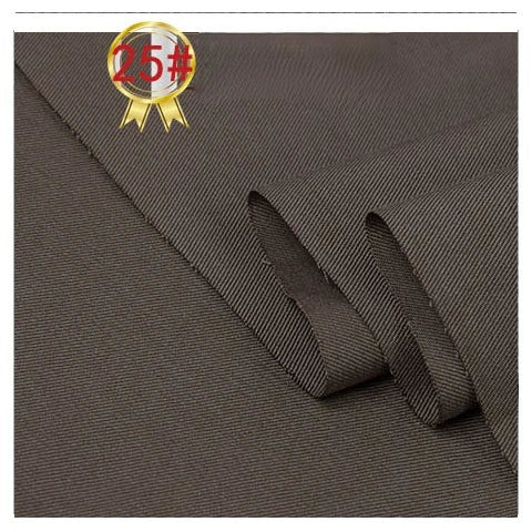 Close-up of Longan Craft Twill Cotton Lyocell Fabric By The Yard, showcasing its dark brown diagonal weave, neatly folded. A gold medal with “25#” in red highlights this comfy, breathable, eco-friendly material ideal for shirts.