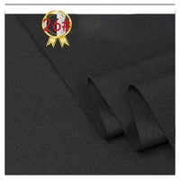 Close-up of folded black Longan Craft Twill Cotton Lyocell Fabric By The Yard, showing its smooth diagonal weave. A gold and red badge labeled 26# appears in the upper left corner of the image.