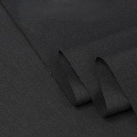 Close-up of Longan Craft’s Twill Cotton Lyocell Fabric By The Yard, featuring a smooth matte finish and fine weave. This comfy, breathable cotton lyocell textile is perfect for shirts and showcases its dense, durable quality when folded.
