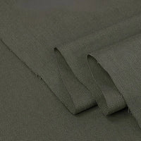 A close-up of Longan Craft's Twill Cotton Lyocell Fabric By The Yard in olive green, featuring a subtle diagonal weave and neatly folded edges—a comfy, breathable, and eco-friendly textile ideal for shirts.