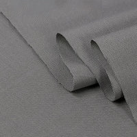 A close-up of Longan Craft’s Twill Cotton Lyocell Fabric By The Yard reveals its light gray, finely-woven texture with a soft, smooth surface and subtle diagonal weave—perfect comfy, breathable material for shirts.