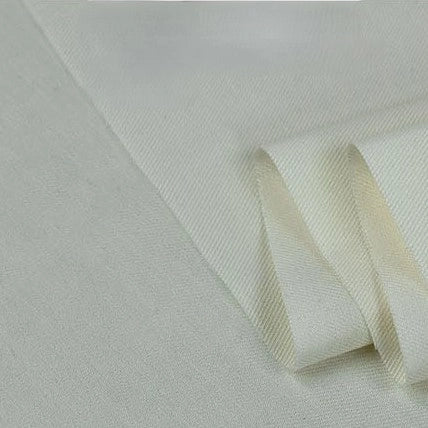 A close-up of Longan Craft’s Twill Cotton Lyocell Fabric By The Yard, a comfy and breathable solid-color textile with a smooth texture and slight sheen—an elegant eco-friendly material ideal for shirts.