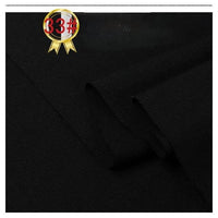 Close-up of Longan Craft Twill Cotton Lyocell Fabric—solid black, comfy and breathable textile with a folded edge. A gold ribbon badge marked 33# in red and black appears in the top left corner.