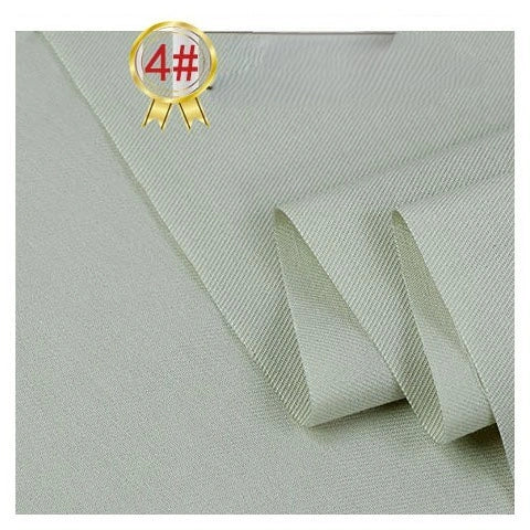 A close-up of Longan Craft’s Twill Cotton Lyocell Fabric By The Yard in a light beige solid color, showing its subtle diagonal weave; the neatly folded material features a gold "4#" badge in the upper left corner.