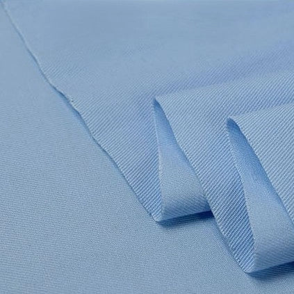 Longan Craft's Twill Cotton Lyocell Fabric By The Yard features a comfy, breathable solid color material, neatly folded to show its smooth texture and subtle diagonal weave—ideal for shirts, clothing, or crafts.