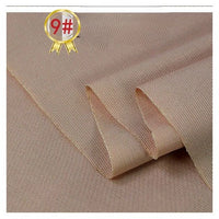 Close-up of Longan Craft’s Twill Cotton Lyocell Fabric By The Yard, featuring a light brown twill weave with a fine diagonal pattern. Soft, comfy, and breathable textile for shirts. A gold badge with 9# in red appears at the top left.