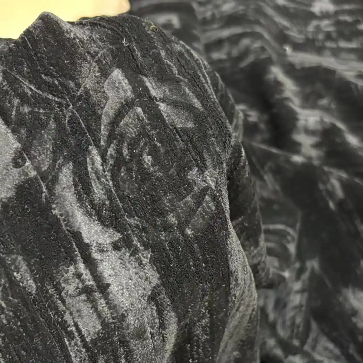 Close-up of Longan Craft Velvet Damask Fabric By The Yard, a classic jacquard weave textile with a subtle textured pattern, perfect for dressmaking. The deep black design blends luxury and elegance across the fabric’s surface.