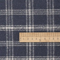 A wooden ruler marked in centimeters lies on Longan Craft’s Vintage Checked Mammoth Flannel Fabric, a thick cotton gingham flannelette with a soft white and gray plaid pattern, showing the scale from 0 to 10 centimeters.