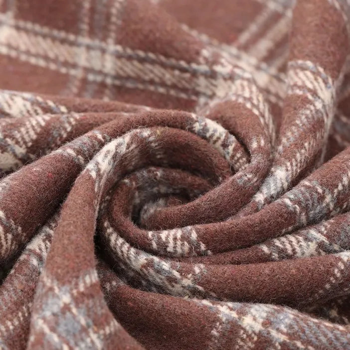 Close-up of the Vintage Checked Mammoth Flannel Fabric by Longan Craft, featuring a soft, brown and beige gingham pattern swirled into a spiral. This thick cotton flannelette fabric is warm and textured, perfect for cozy clothing or blankets.