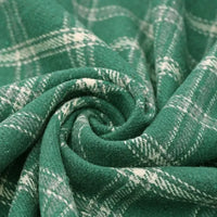 The Vintage Checked Mammoth Flannel Fabric By The Yard from Longan Craft features a soft, thick cotton gingham flannelette in green and white plaid, arranged in a swirl pattern to showcase its cozy texture and classic checkered design—perfect for fall sewing projects.