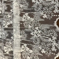 Longan Craft's Vintage Floral Embroidery Lace Fabric by the yard features cotton botanical patterns—ideal for elegant dresses or bridal gowns. Shown flat on a dark background.