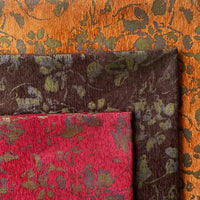 Three overlapping Vintage Flower Pattern Chenille fabrics by Longan Craft: orange with greenish leafy motif, dark brown with green, and red with green. All are Jacquard chenille, perfect for decorative pillows and home decor.