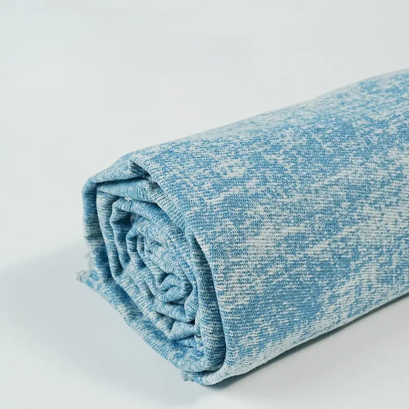 A roll of Longan Craft's Washed Denim Fabric by the Yard—premium, vintage-washed cotton denim textile in a soft blue and white mottled pattern—is displayed on a plain white background.