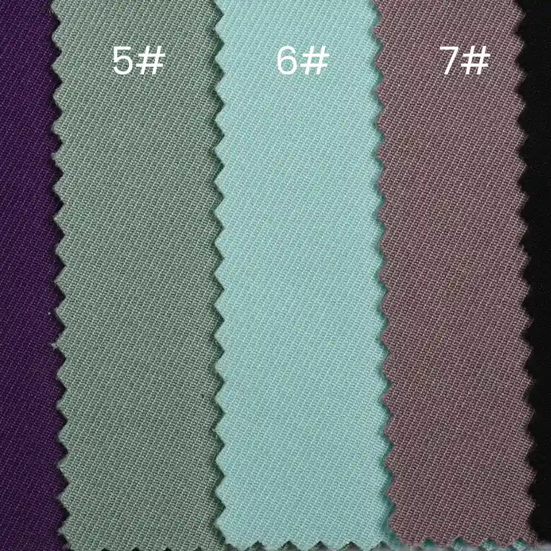 Four swatches of Longan Craft's Waterproof Gabardine Fabric By The Yard—solid color twill in purple, gray, light blue, and mauve (labeled 5#, 6#, 7#)—are ideal for durable, water-resistant workwear and outdoor apparel projects.