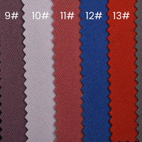 Several vertically arranged, pinked-edge swatches of Longan Craft Waterproof Gabardine Fabric By The Yard (colors 9#–13#) showcase this water-resistant twill—ideal for workwear and outdoor apparel.