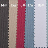 Five Longan Craft waterproof gabardine fabric swatches (#14–18) display solid colors—dark gray, beige, pink, light blue, and light gray—with a zigzag edge. Ideal for workwear, these are durable water-resistant twill textiles by the yard.
