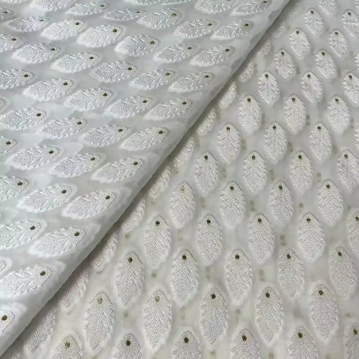 Longan Craft's White Leaf Pattern Organza Fabric by the yard features silver and gold embroidered leaf motifs with gold dots, arranged in diagonal rows—ideal botanical jacquard organza material for clothing.
