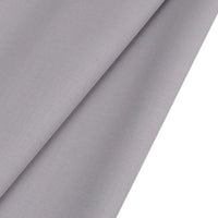 A close-up of Longan raft Worsted Wool Gabardine Fabric By The Yard shows its smooth, slightly textured light gray poly wool blended twill surface, folded neatly—perfect durable material for tailored suits.