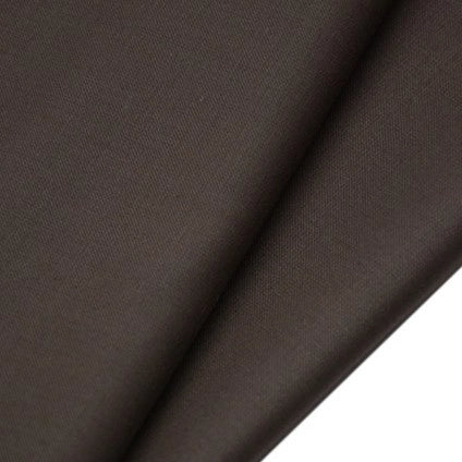 Close-up of Longan Raft Worsted Wool Gabardine Fabric by the yard, a durable poly wool blended twill textile. The smooth, tightly woven material displays soft diagonal lines and subtle shadows, perfect for tailored suits and wrinkle-resistant wear.