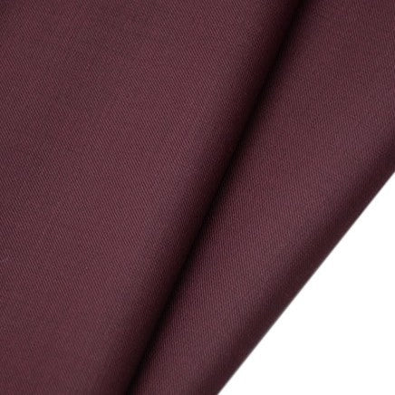 A close-up of Longan raft’s Worsted Wool Gabardine Fabric by the yard shows its smooth, slightly textured, wrinkle-resistant poly wool twill—ideal, durable material for tailored suits.