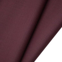 A close-up of Longan raft’s Worsted Wool Gabardine Fabric by the yard shows its smooth, slightly textured, wrinkle-resistant poly wool twill—ideal, durable material for tailored suits.