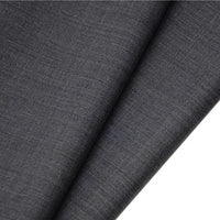 A close-up of Longan raft’s Worsted Wool Gabardine Fabric by the yard, a durable poly wool blended twill in dark gray, neatly folded to show its wrinkle-resistant, finely textured surface—ideal for tailored suits.
