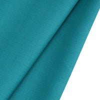 Close-up of Longan raft’s Worsted Wool Gabardine Fabric By The Yard in vibrant teal. This colorful, poly-wool blended twill gabardine features a wrinkle-resistant, smooth yet slightly textured surface—ideal for tailored suits.