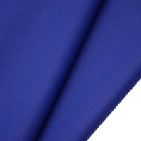 Close-up of Longan raft's Worsted Wool Gabardine Fabric by the Yard shows two overlapping pieces in royal blue, highlighting the fine weave, soft texture, and wrinkle-resistant durability ideal for tailored suits.
