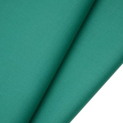 A close-up of two overlapping pieces of Longan raft’s Worsted Wool Gabardine Fabric shows the smooth, teal-colored poly-wool twill texture and fine weave of this durable, wrinkle-resistant material for tailored suits.