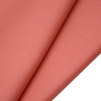 Close-up of two overlapping pieces of Longan raft Worsted Wool Gabardine Fabric, a coral pink poly wool blended twill. The material is smooth, slightly textured, and folded to highlight its soft, even finish—ideal for tailored suits.