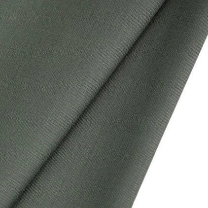 A close-up of Longan raft Worsted Wool Gabardine Fabric by the Yard in dark gray, showing its wrinkle-resistant, smooth poly-wool twill texture and drape on a plain white background. Ideal for durable, tailored suits.