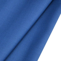 A close-up of Longan raft's Worsted Wool Gabardine Fabric shows its smooth, folded blue poly-wool blended twill with a soft texture and subtle shadows, perfect for durable, tailored suits by the yard.