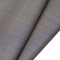 Close-up of two overlapping pieces of Longan raft Worsted Wool Gabardine Fabric By The Yard, a colorful poly wool blended twill with a subtle textured weave and smooth, slightly glossy surface, ideal for tailored suits.