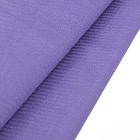 A close-up of folded Longan raft Worsted Wool Gabardine Fabric By The Yard in light purple, highlighting its wrinkle-resistant, smooth poly wool twill texture and subtle weave—ideal for tailored suits.