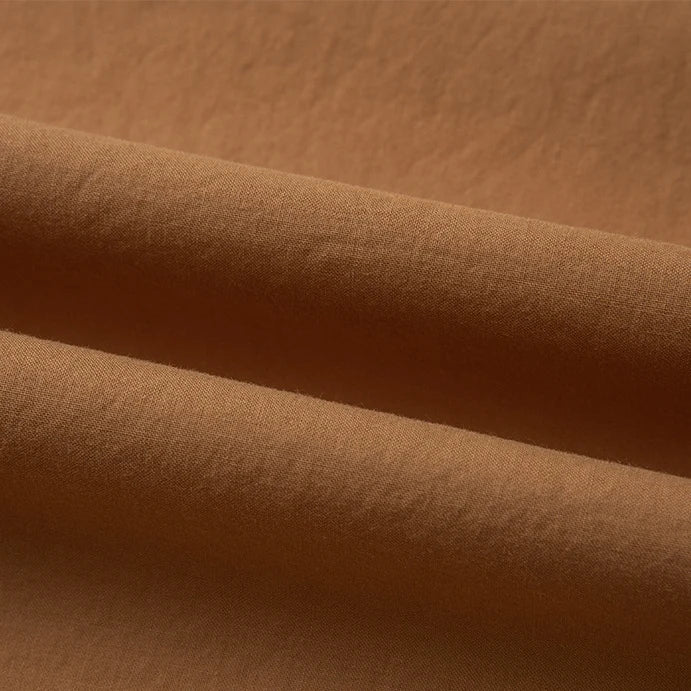 Close-up of Longan Craft’s Woven Lawn Fabric By The Yard, a multicolor cotton lawn material with smooth texture and soft folds, highlighting its breathable, soft qualities—ideal as a cotton lawn lining.