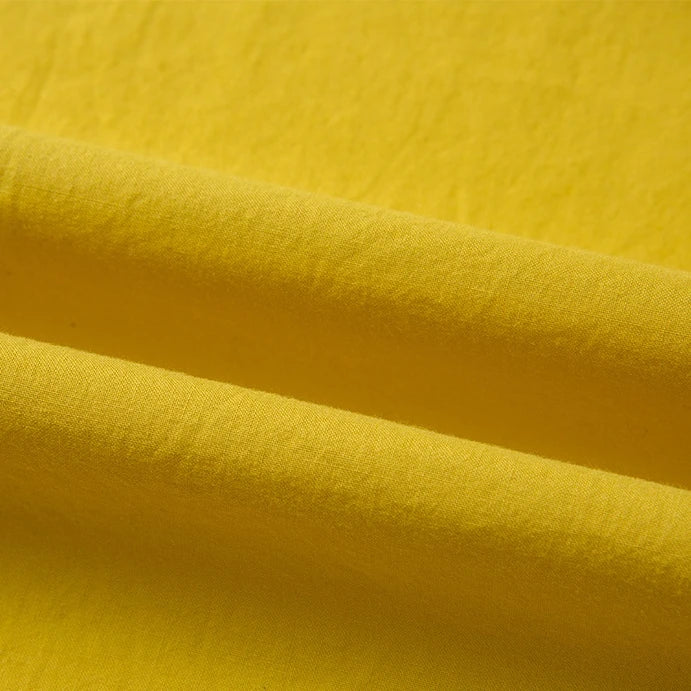 A close-up of Longan Craft's Woven Lawn Fabric By The Yard shows the multicolor cotton lawn material's soft texture, gentle folds, and subtle shadows—ideal as a soft cotton lawn lining.