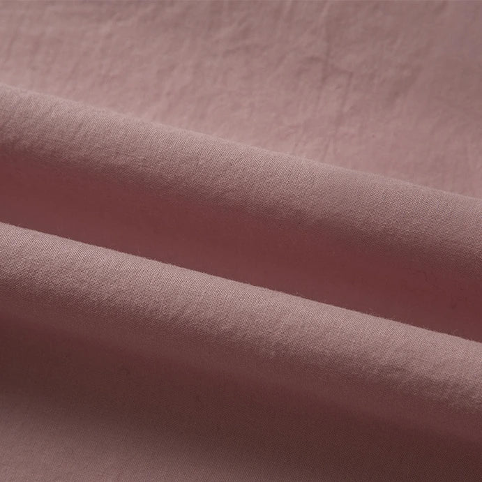 Close-up of Longan Craft Woven Lawn Fabric by the yard, a soft multicolor cotton lawn material with gentle folds and a slightly textured surface—ideal as lining.