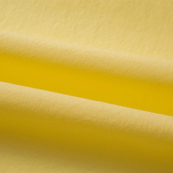 Close-up of Longan Craft's Woven Lawn Fabric By The Yard, a multicolor cotton lawn material with gentle folds, highlighting its smooth texture, breathable quality, and vibrant color—ideal as a soft cotton lawn lining.
