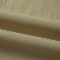 Close-up of Longan Craft’s Woven Lawn Fabric by the yard, a multicolor cotton lawn material with a soft, smooth texture. Gentle folds and subtle shadows highlight its natural weave—ideal as a cotton lawn lining for your projects.