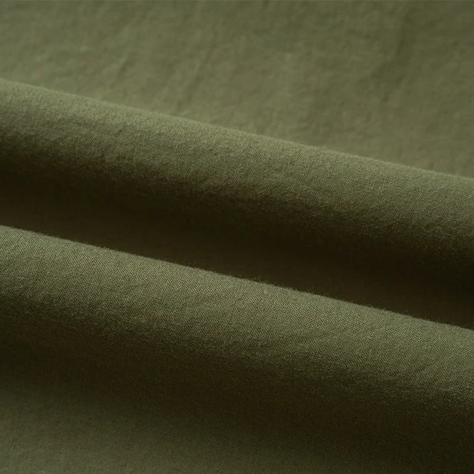 Close-up of Longan Craft’s Woven Lawn Fabric By The Yard: a multicolor cotton lawn material with a soft, smooth texture and subtle shadows highlighting the gentle drape. Ideal as a soft cotton lawn lining.