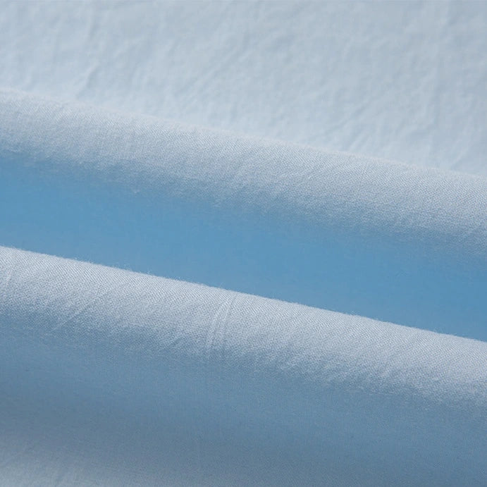 Close-up of Longan Craft’s Woven Lawn Fabric By The Yard, a multicolor cotton lawn material. The soft, breathable fabric features gentle folds and subtle creases, appearing smooth and lightweight under natural light.
