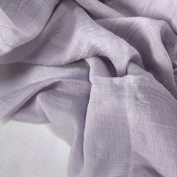 Longan Craft's Wrinkled Lyocell Fabric By The Yard is a breathable, sustainable textile in a light lavender solid color. With a slightly crinkled texture, it drapes softly for layered, airy tops and gentle folds—perfect for eco-friendly projects.