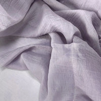 Longan Craft's Wrinkled Lyocell Fabric By The Yard is a breathable, sustainable textile in a light lavender solid color. With a slightly crinkled texture, it drapes softly for layered, airy tops and gentle folds—perfect for eco-friendly projects.