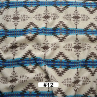 Longon Craft's Christmas Polar Fleece Fabric By The Yard features a geometric brown and blue zigzag and diamond print on white, with double-sided thick polyester, labeled #12 at the bottom center.