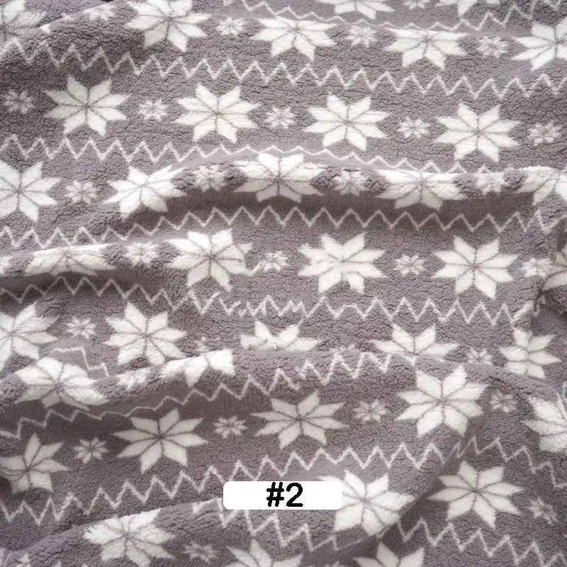 Add cozy holiday style with Longon Craft’s Christmas Polar Fleece Fabric By The Yard, a gray and white double-sided polyester fleece featuring snowflakes and zigzag lines—perfect for festive décor and sewing projects. White label at center reads “#2” in black.