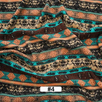 A slightly wrinkled yard of Longon Craft Christmas Polar Fleece Fabric, printed double-sided with horizontal black, teal, brown, tan, and orange geometric and tribal patterns. Label #4 appears at the bottom center.