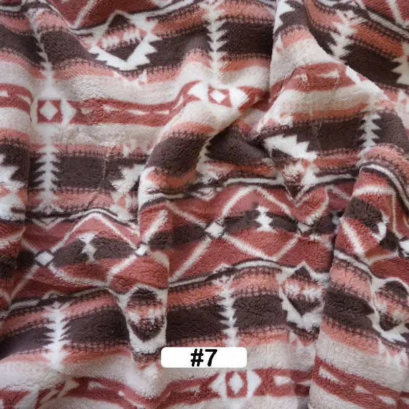 Longon Craft’s Christmas Polar Fleece Fabric By The Yard features a pink, brown, and white Southwestern geometric design, made from double-sided thick polyester—ideal for holiday sewing projects.