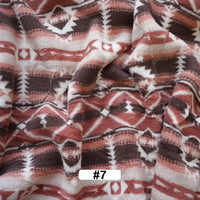 Longon Craft’s Christmas Polar Fleece Fabric By The Yard features a pink, brown, and white Southwestern geometric design, made from double-sided thick polyester—ideal for holiday sewing projects.